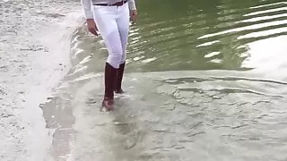 Walking in the lake soaking my brown riding boots