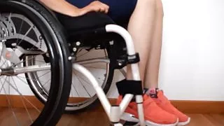 Tetraplegic girl gets spasm on both legs while sitting in he