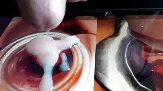 Cumshot a the photo of a wide open pussy by a speculum