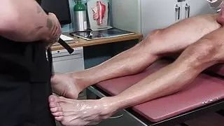 Muscular hunk jerks off while hunky doctor fucks his feet