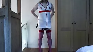 crossdressed slutty nurse talking dirty with flogger