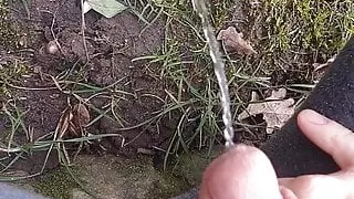 German Teen Boy sitting outside and pissing
