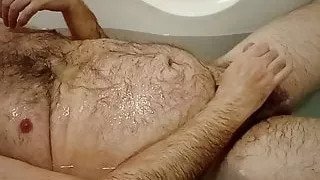 Guy masturbating and pissing on himself