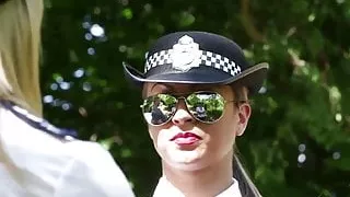 Clothed European police women tug
