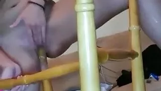 Girl fucks with a chair
