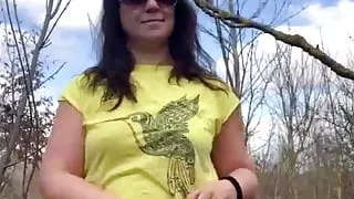 A MILF undresses in the open air: Outdoor Strip