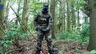 Soldier pup pawing off in the woods