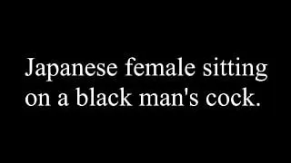 Japanese female sitting on a black man's cock.