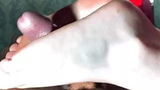 the bitch professionally jerks off with her feet 18+