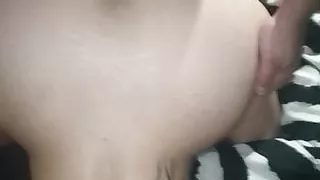 From behind with his wife