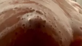 Playing with my pierced nipples in the shower