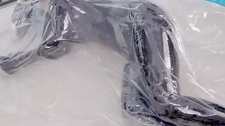 DOVE – Latex bodysuit on vacuum bag breathplay