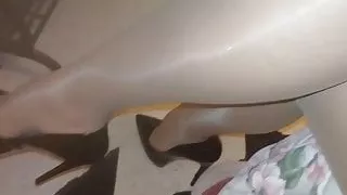 shiny pantyhose and high heels dangling