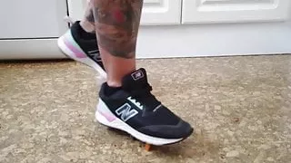 Tattooed Blonde Lady Trying To Tread On A Rolling Toy