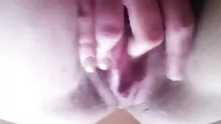 She plays with her ass and pussy until she squirts