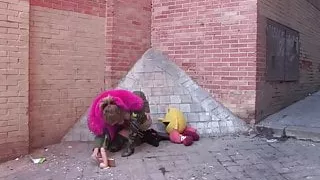 Sexy exhibitionist babe teases dudes in the street