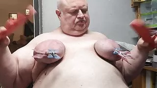 Clothpins on the nipple and red FlipFlops