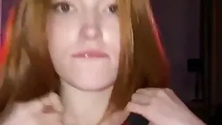 Redhead in a red dress