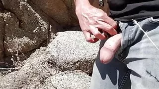 Public Golden shower in a drainage ditch