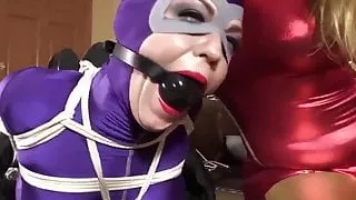 Cat woman in bondage on table