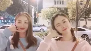 Chinese girl with her female friend in bed.