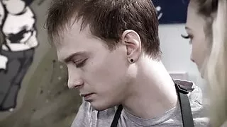 Petite blonde helps customer while she’s rimmed behind counter