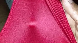 Wearing and stroking in a sexy pink red thong.