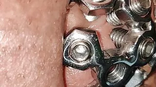 close up of the set screw in my chastity cage