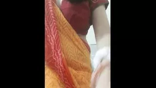 Aunty taking off yellow saree