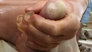 Jack off in LATEX pants and gloves at the changing room