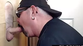 Gloryhole stud eagerly sucking dick through wall before anal