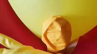Rubberboy masturbates with rubber gloves and balloon