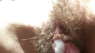 the most wonderful hairy cunt with cum on her clit