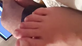 girlfriend  pedicured long feet and toes in bed