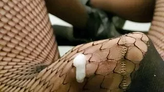 Crossdresser cumming in fishnet pantyhose.
