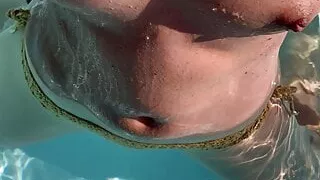 Naughty wife in the pool showing off