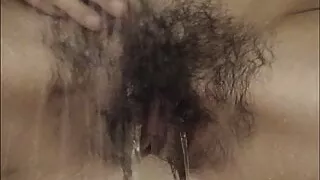 Very hairy Inge enjoys a shower after sport