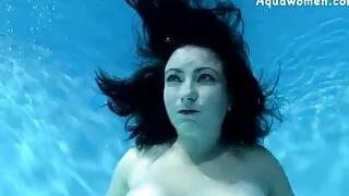 Brunette with big tits underwater