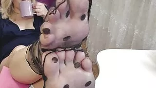 Juicy blonde in stockings caresses her pussy