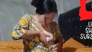 Asian woman milking her big boobs