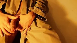 Gay men jerking big cock in a raincoat.