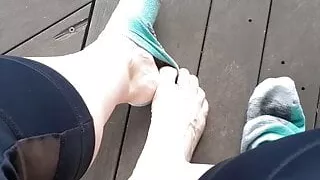 Taking off my socks outside and rubbing my feet together
