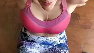 Girl Sitting on Floor Laughs at Her Facial