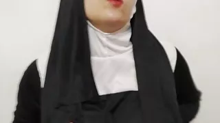 sexy nun is playing with a fake dick