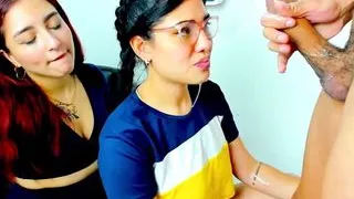 One Latina nibbles the cock while the other gets throated