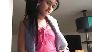Cute teen touches herself with objects