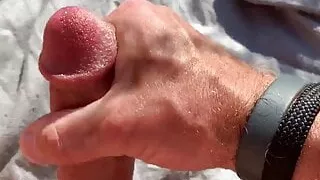 Stroking my hard cock in the field, stay tuned for more!