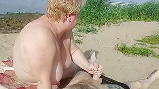 sucking cock and jerking off on a public beach
