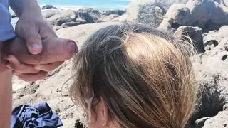 Exciting blowjob in public with people on the beach