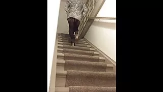Sissy crossdresser walking upstairs sexy in heels stockings